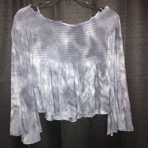 Blue strapless American Eagle shirt.